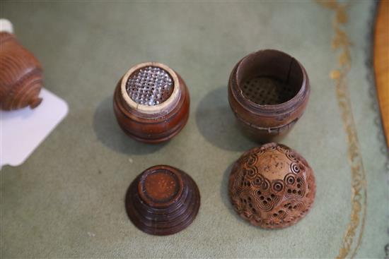 Five 19th century coquilla nut nutmeg graters and two condiment shakers, largest 7.2cm